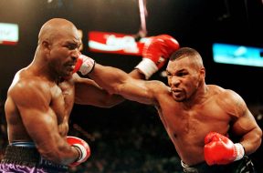 TYSON PUNCHES HOLYFIELD IN WBA HEAVYWEIGHT TITLE