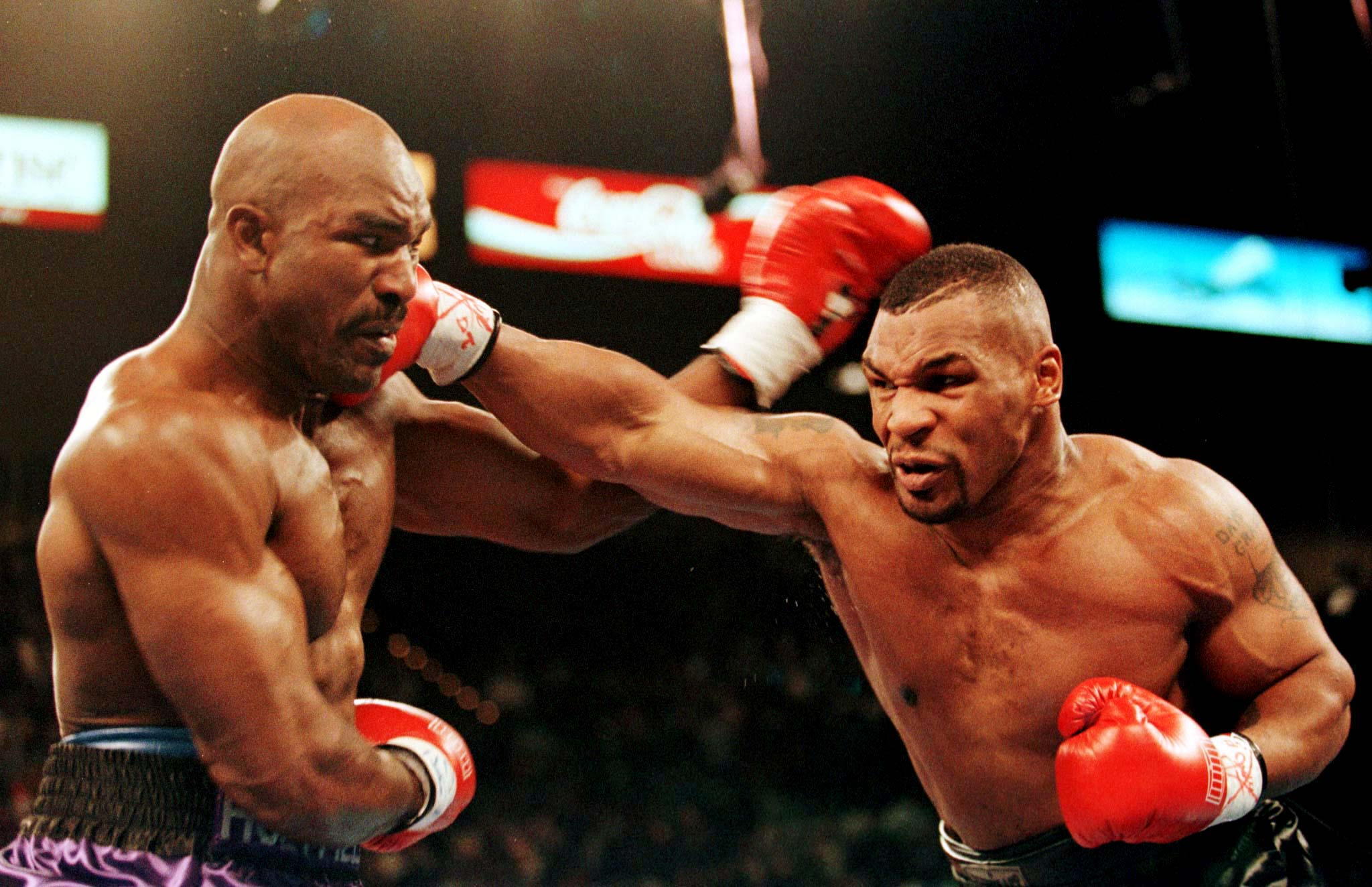 TYSON PUNCHES HOLYFIELD IN WBA HEAVYWEIGHT TITLE
