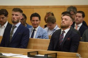 Mixed martial arts (MMA) fighters McGregor and Cowley wait to plead guilty to disorderly conduct during a hearing in Brooklyn